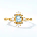 Elegant Blue Gemstone Ring With Pearl Accents - Image 3